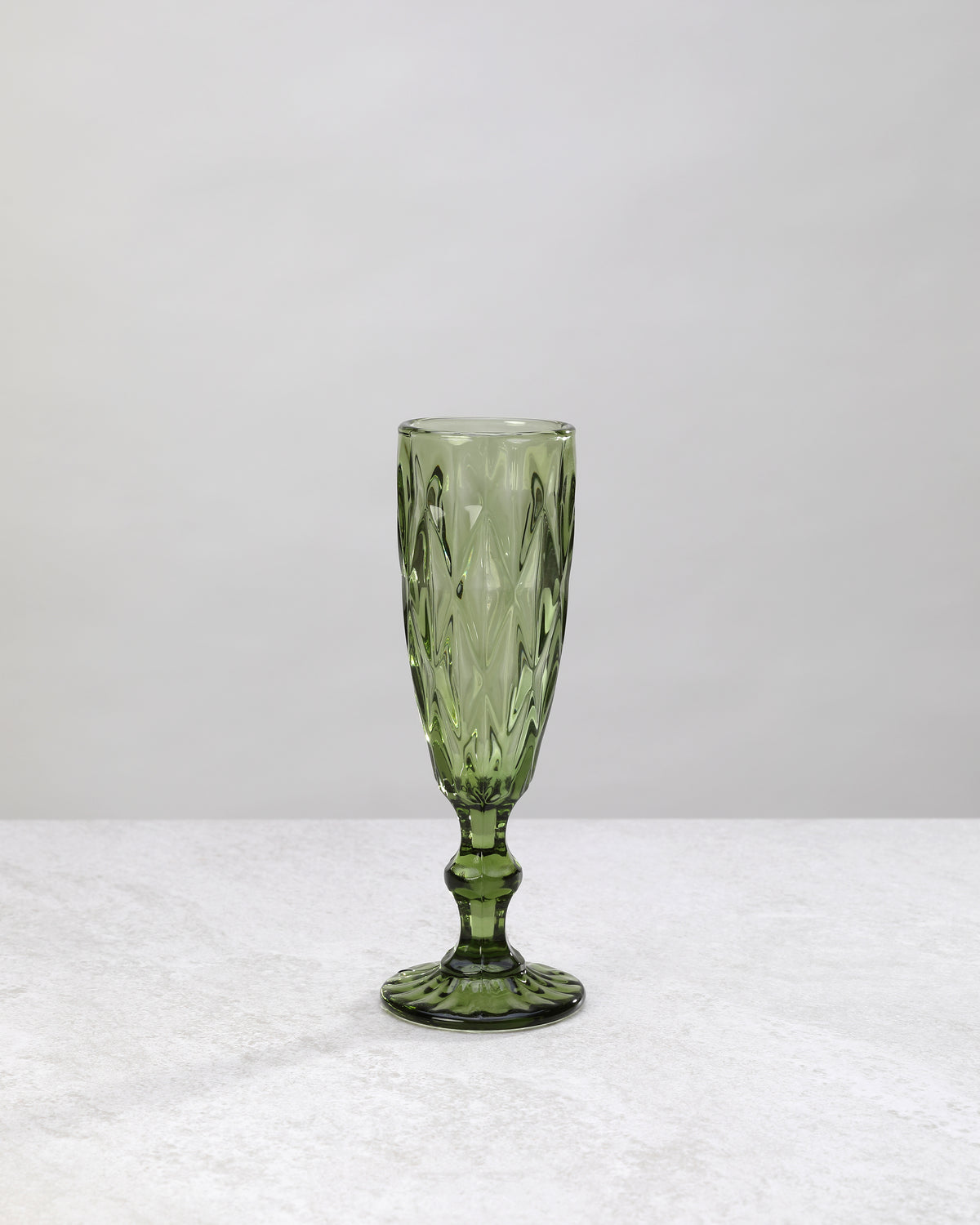 Single olive green diamond cut champagne flute, front view