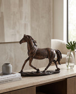 Resin horse figure on a console in a living room