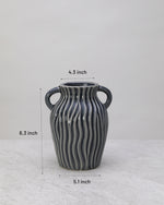 Grey ribbed ceramic decorative pot with its dimensions marked