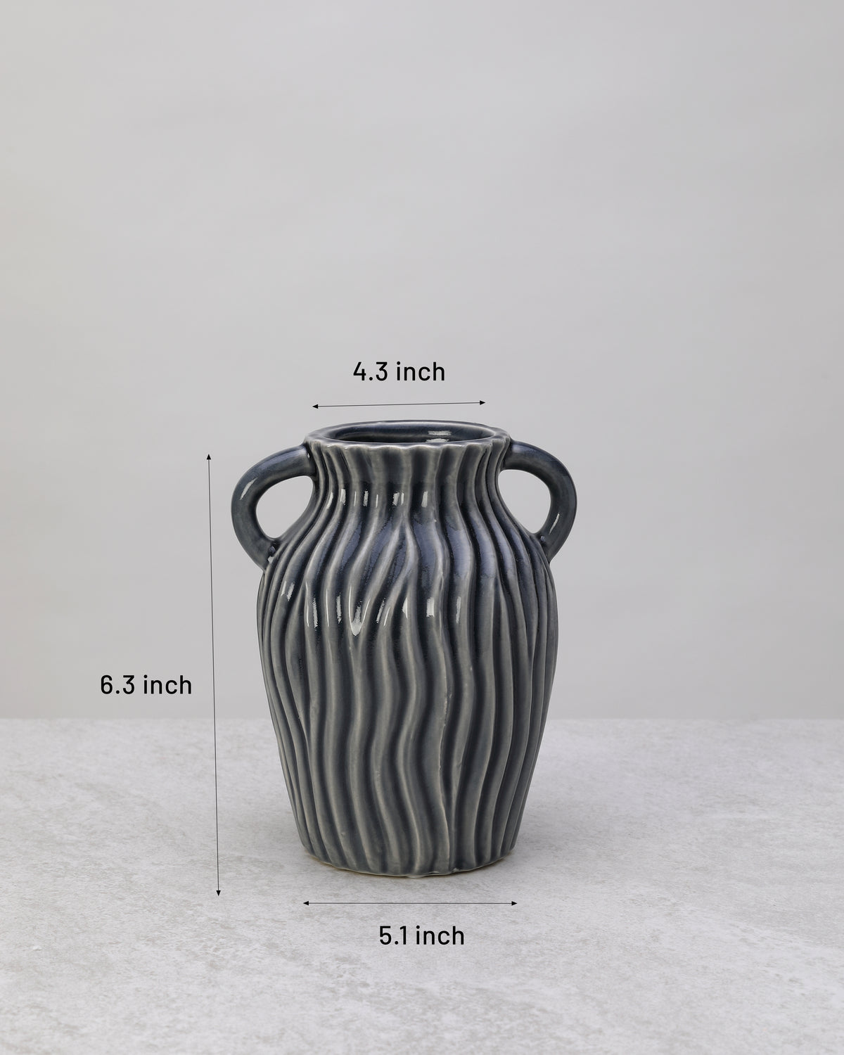 Grey ribbed ceramic decorative pot with its dimensions marked