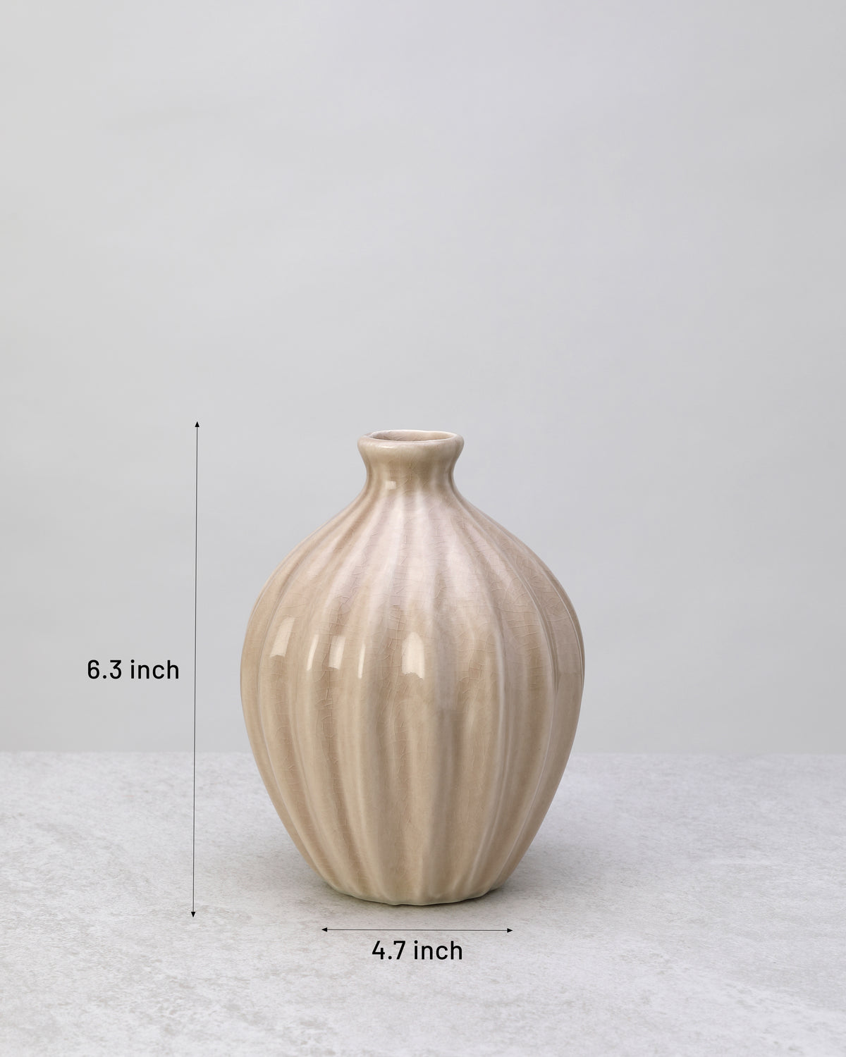 Beige glazed ceramic decorative pot with its dimensions marked
