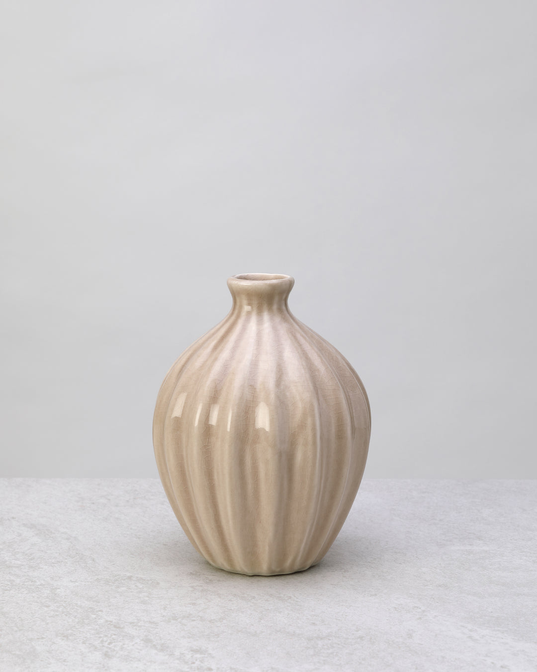 Beige glazed ceramic decorative pot with ribbed sides