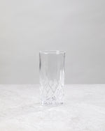 Single clear machine cut high ball glass, front view