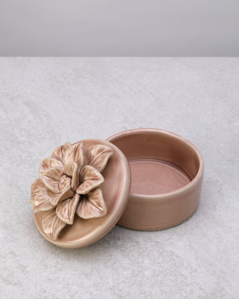 Blush pink glazed ceramic trinket box with a flower lid