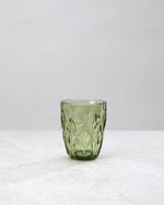 Single olive green diamond cut tumbler glass, front view