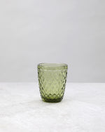 Single olive green small diamond tumbler glass, front view