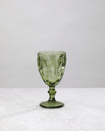 Single olive green diamond cut wine glass, front view