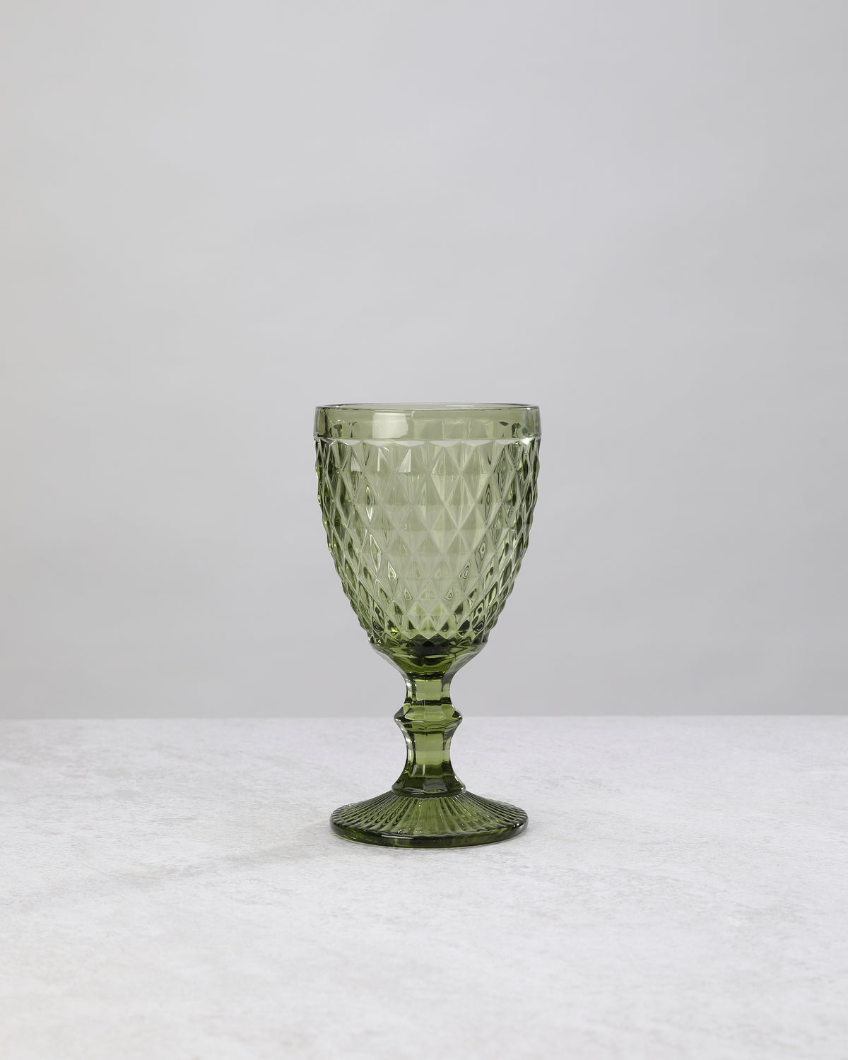 Single olive green small diamond wine glass, front view