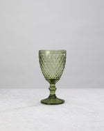 Single olive green small diamond wine glass, front view