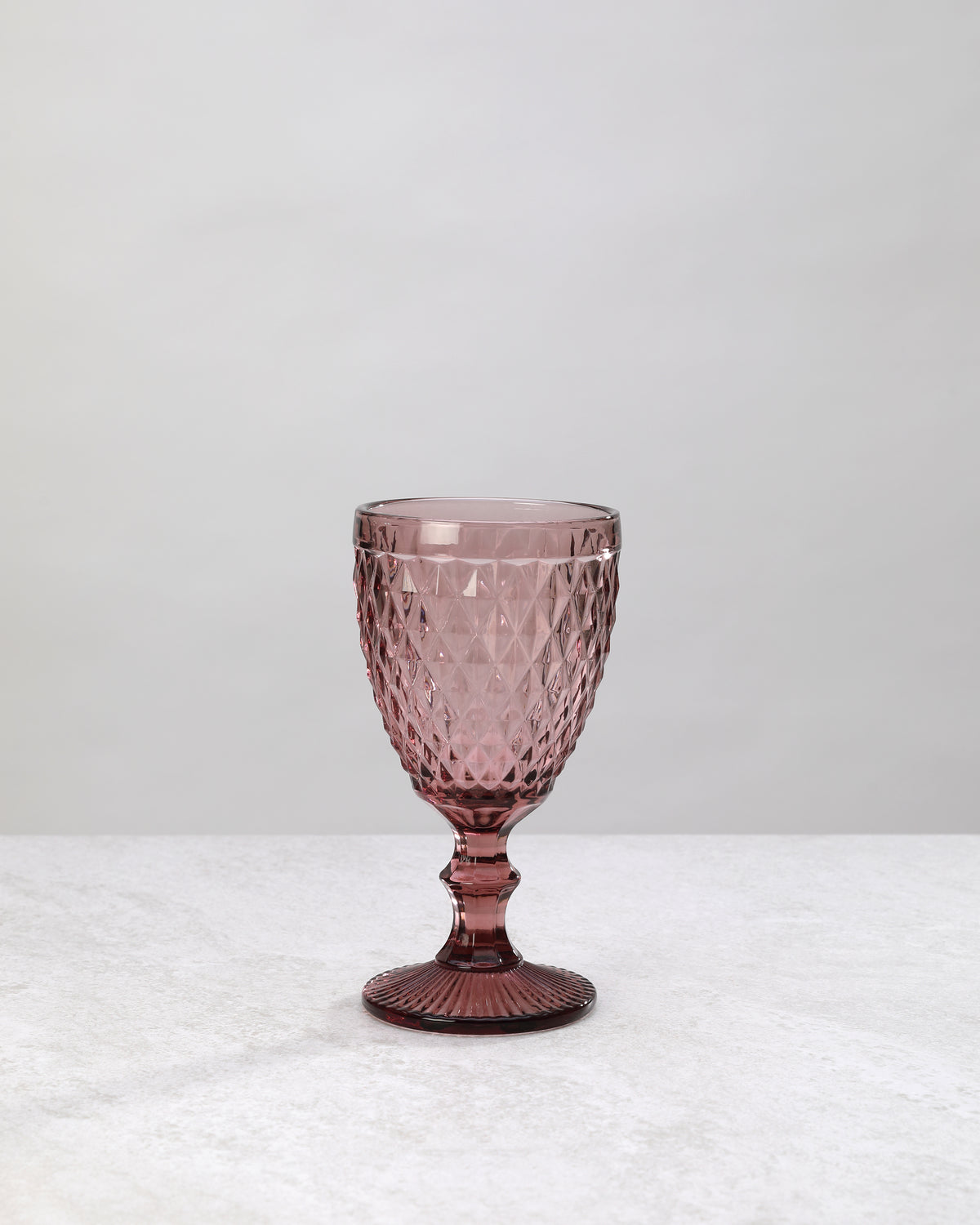 Single pink small diamond wine glass, front view