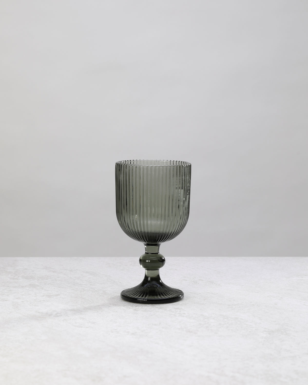 Single hunter green ribbed wine glass, front view