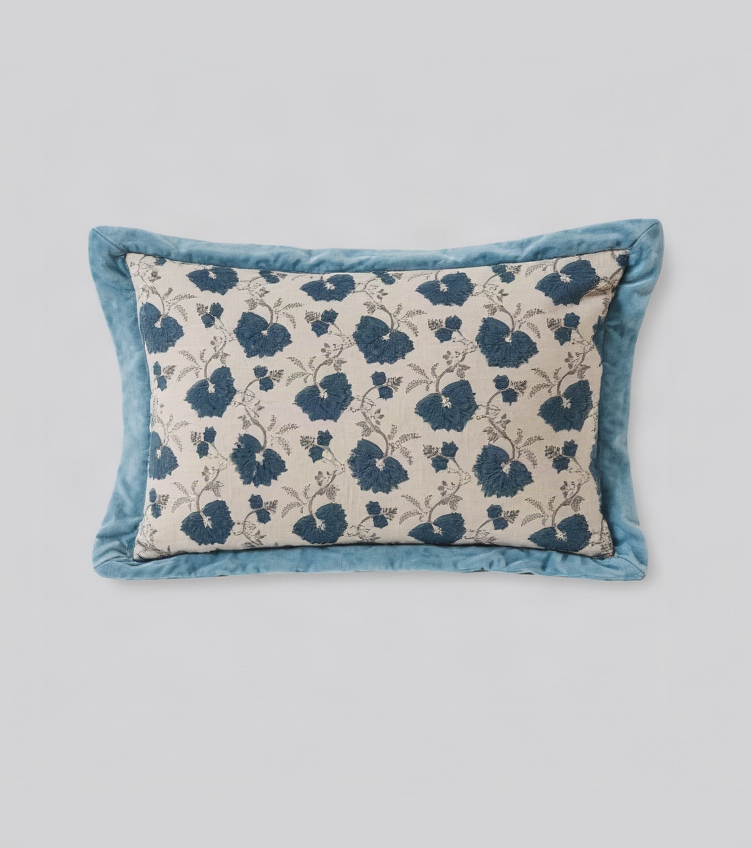 Blue flange lumbar cushion cover with a blue floral print on cream and a wide velvet border