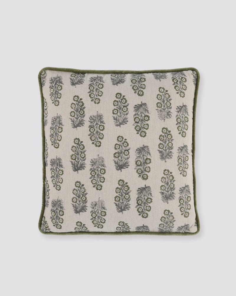 Moss piped cushion cover with green leaf motifs on cream and a green piped edge, front view
