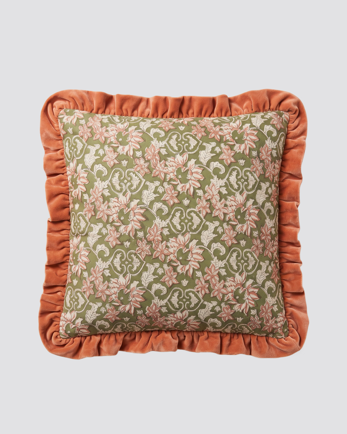 Orange frill cushion cover with a floral block print and a rust ruffled edge, front view