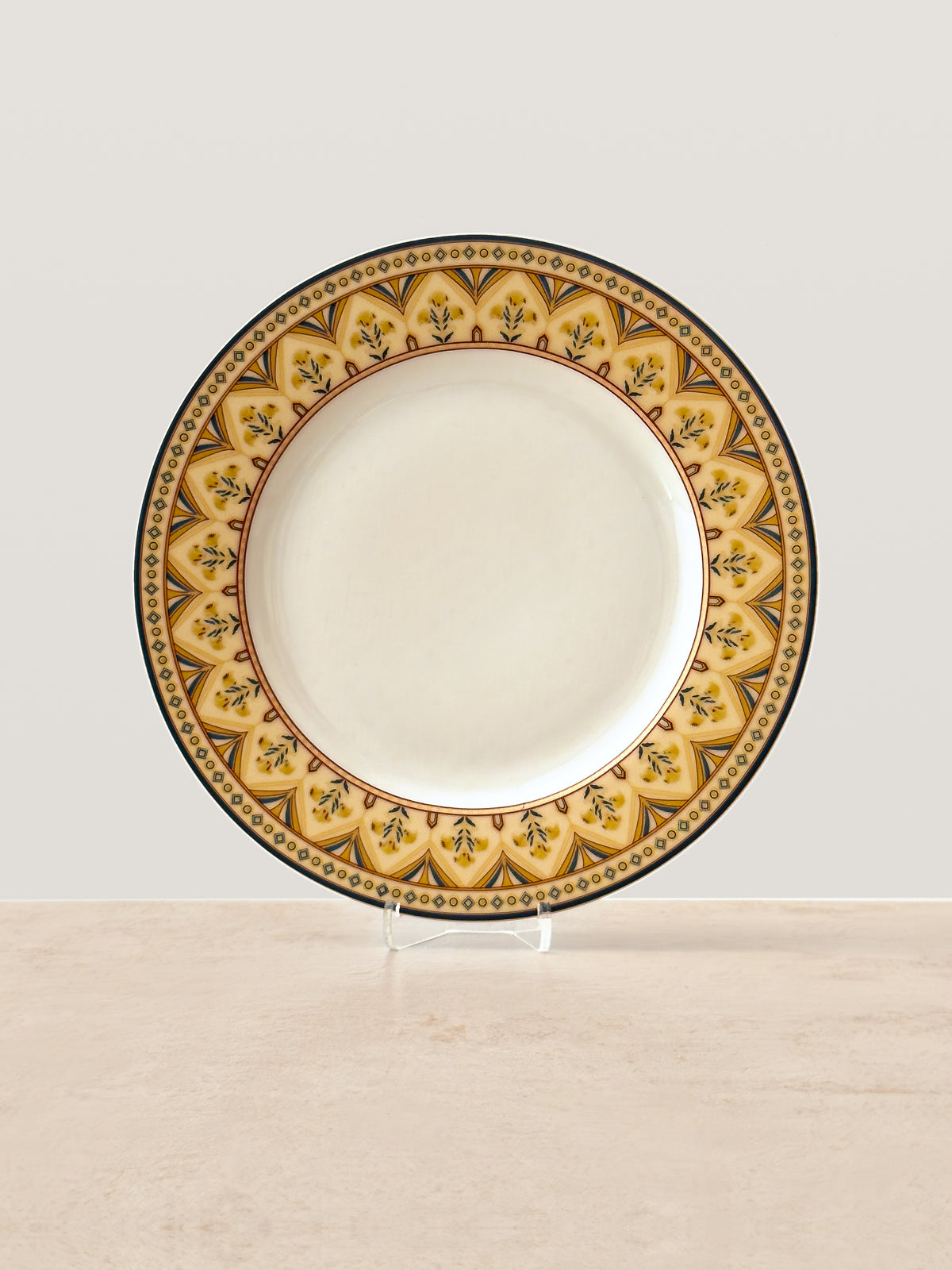Mor Bagh Dusk porcelain dinner plate on a stand, gold and dark green patterned rim