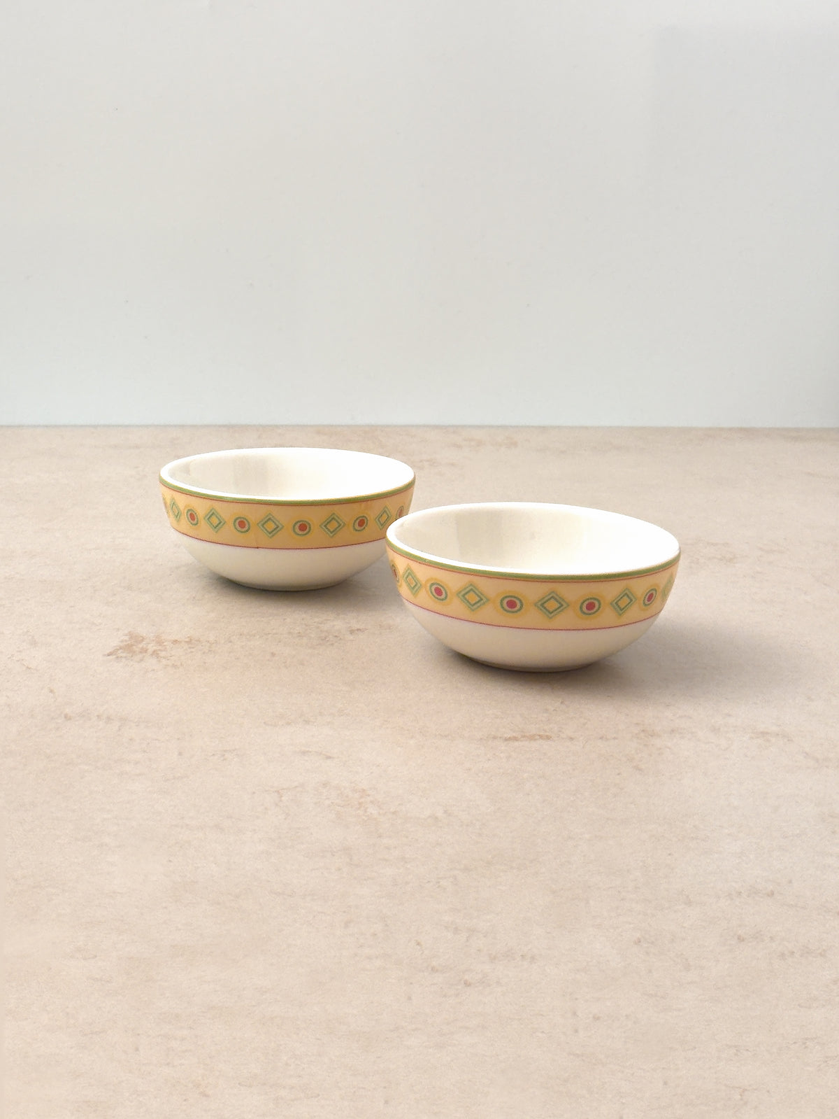 Pair of Mor Bagh Dawn porcelain katori bowls, one set slightly behind the other, angled view