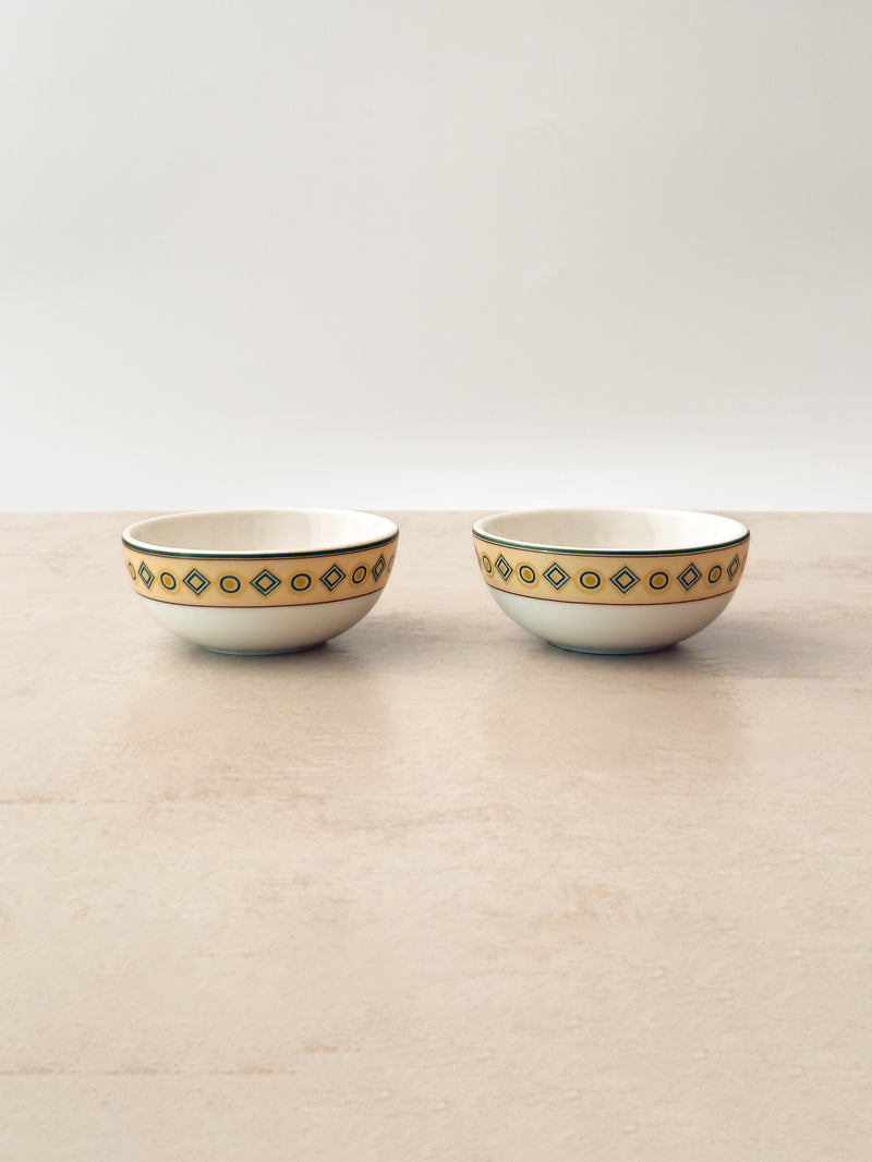 Two Mor Bagh porcelain katoris in Dusk with a dark green printed border, front view
