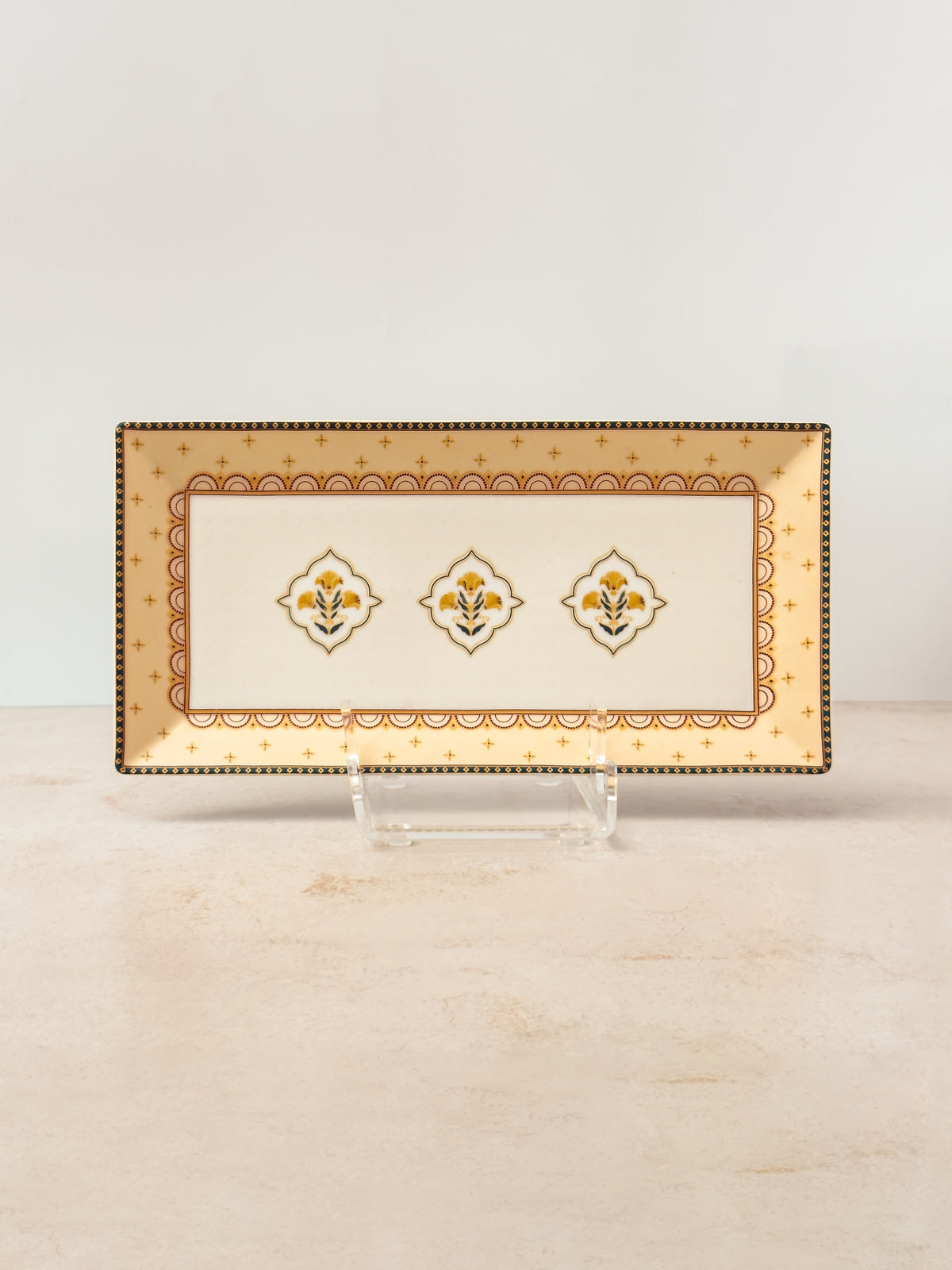 Mor Bagh Dusk porcelain rectangular platter on a stand, gold border edged in dark green