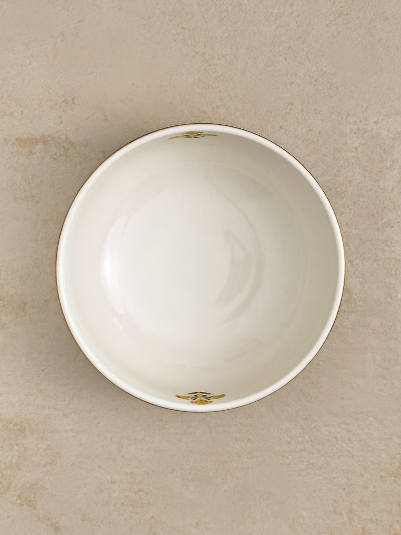 Mor Bagh Dusk salad bowl from above, white inside with a small printed motif at the rim