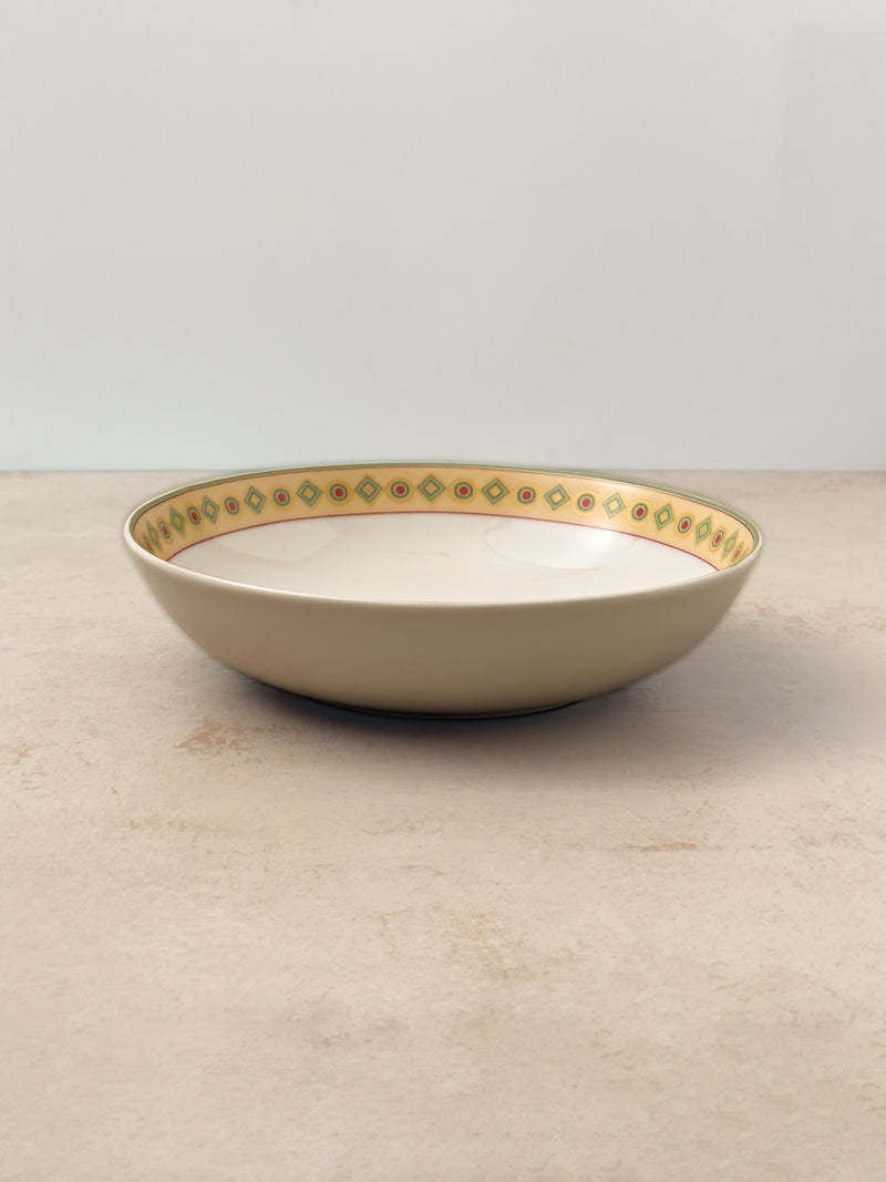 Mor Bagh Dawn porcelain serving bowl, low and wide with a printed rim, side view