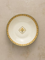 Mor Bagh Dusk serving bowl from above with a green and gold border and a small centre motif