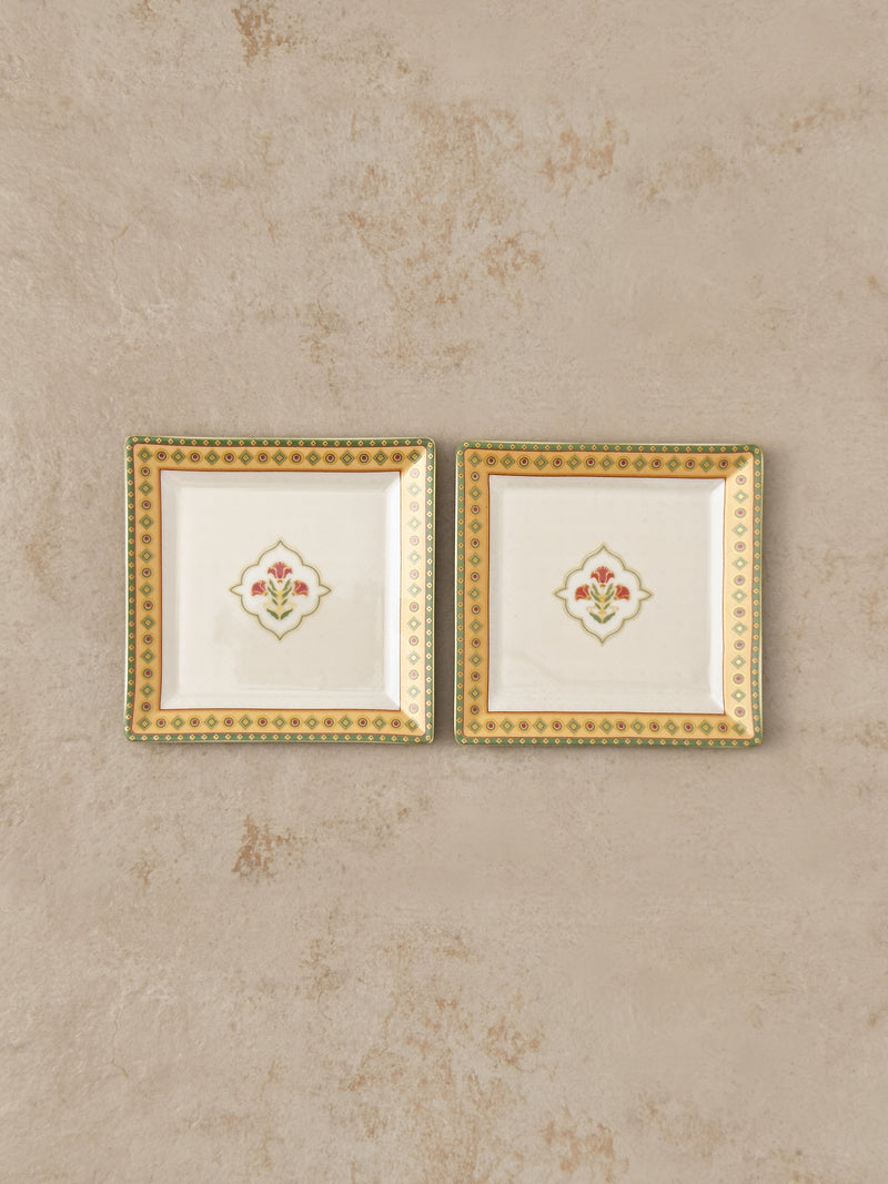 Pair of Mor Bagh Dawn square platters from above, side by side on stone