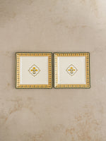Pair of Mor Bagh Dusk square platters from above on a stone background
