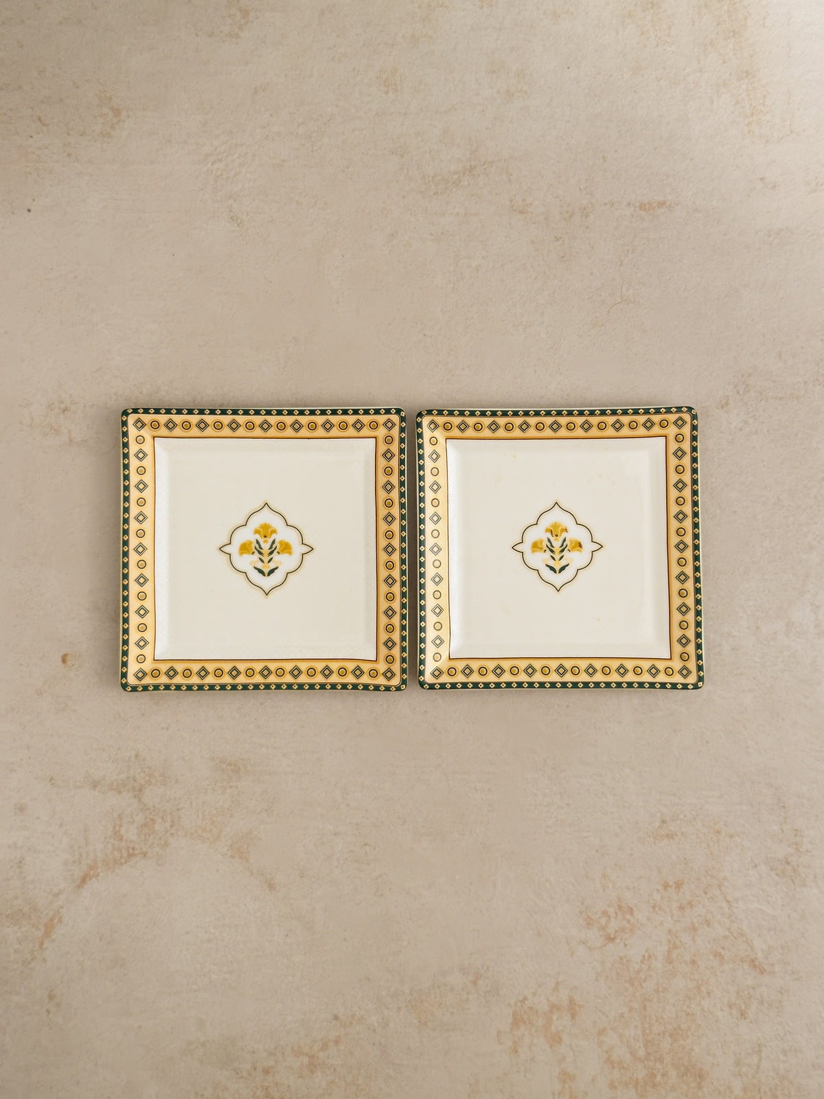 Pair of Mor Bagh Dusk square platters from above on a stone background