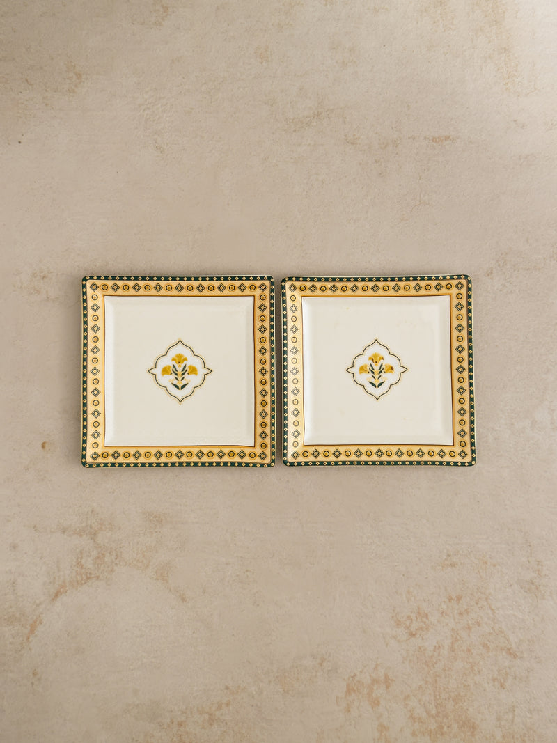 Pair of Mor Bagh Dusk square platters from above on a stone background