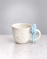 Powder blue ribbon bow ceramic mug, side view