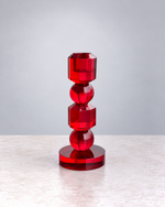 Small ruby red faceted crystal glass candle holder, front view on white