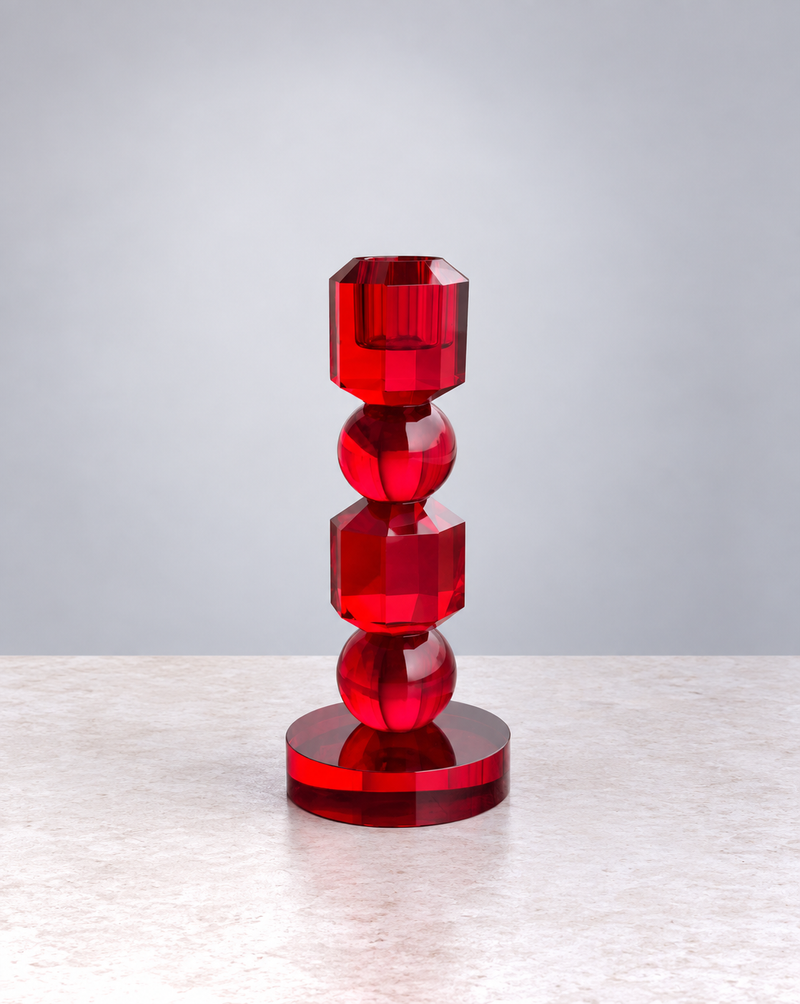 Small ruby red faceted crystal glass candle holder, front view on white